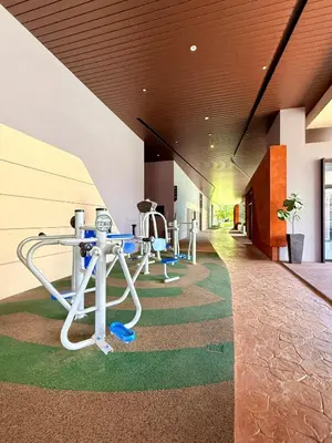 a row of treadmills in a building with a hallway at Luxury Axon Residence Bukit Bintang KLCC Pavilion By EQZ in Kuala Lumpur