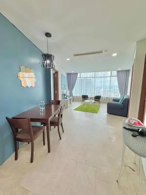 a living room with a table and a couch at Apartment Kuala Lumpur City 3 Minutes To KLCC in Kuala Lumpur