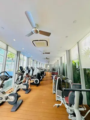 a gym with a row of treadmills and machines at Apartment Kuala Lumpur City 3 Minutes To KLCC in Kuala Lumpur