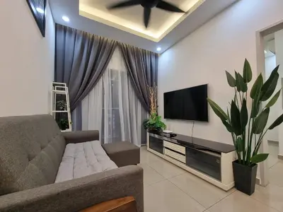 a living room with a couch and a flat screen tv at Awani3 Homestay Setapak, KL in Kuala Lumpur