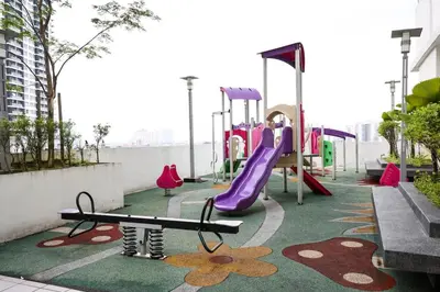a playground with a slide and a slide at One Maxim Sentul By LuxeStay in Kuala Lumpur