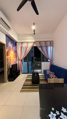 a living room with a blue couch and a ceiling fan at Luxe Colony By Urban Haven in Kuala Lumpur