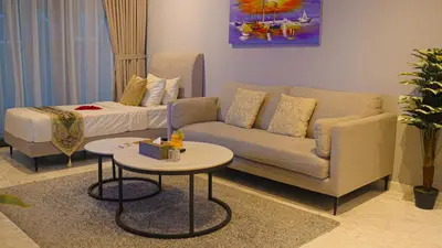 a living room with a couch and a table at Eaton Residences KLCC- JD World Homestay in Kuala Lumpur