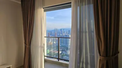 a view of a city from a hotel room window at Trion KL Skyline Suites in Kuala Lumpur