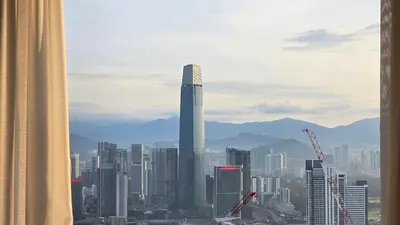 a view of a city with a tall skyscraper at Trion KL Skyline Suites in Kuala Lumpur