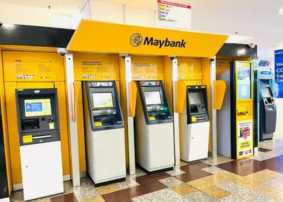a row of maybank machines in a building at Max suites in Kuala Lumpur