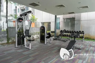 a gym with cardio equipment in a building at Summer Suites Residences KLCC in Kuala Lumpur