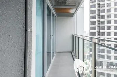 a balcony with a view of a building at Summer Suites Residences KLCC in Kuala Lumpur