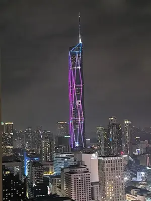 a lit up tower in a city at night at The Bukit Bintang Near pavilion Axon Residence KL in Kuala Lumpur