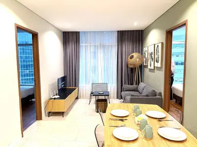 a living room with a table and a couch at sky suites klcc by Natasya in Kuala Lumpur