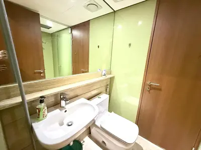 a bathroom with a sink and a toilet and a mirror at sky suites klcc by Natasya in Kuala Lumpur