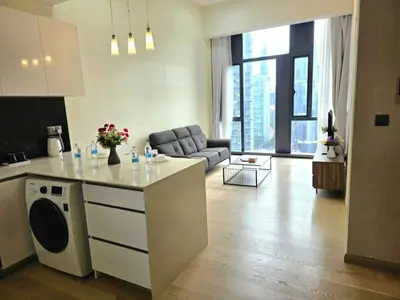 a kitchen and living room with a couch and a table at A1 Hospitality At Star Residence KLCC in Kuala Lumpur