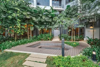 a courtyard with a fountain in front of a building at Earthy 2BR @ Agile BB | Wi-Fi + Netflix in Kuala Lumpur
