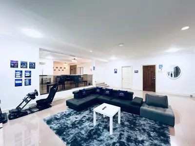 a living room with a couch and a table and a piano at 9 Min KLCC 9KM Mid Valley Karaoke 30Pax 7Car in Kuala Lumpur