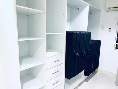 a white closet with white shelves and a black refrigerator at 9 Min KLCC 9KM Mid Valley Karaoke 30Pax 7Car in Kuala Lumpur