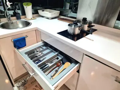 an open drawer in a kitchen with pots and pans at Summer suites klcc by Amna in Kuala Lumpur