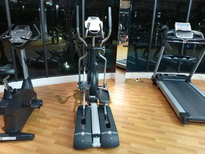 a gym with two exercise bikes and a treadmill at B&B at TRION KL in Kuala Lumpur