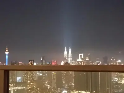 a view of the city at night at B&B at TRION KL in Kuala Lumpur