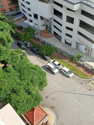 an aerial view of cars parked in a parking lot at Cozy Suite City Central in Kuala Lumpur
