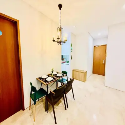a dining room with a table and chairs at sky suites klcc by Sweet home Apartment in Kuala Lumpur