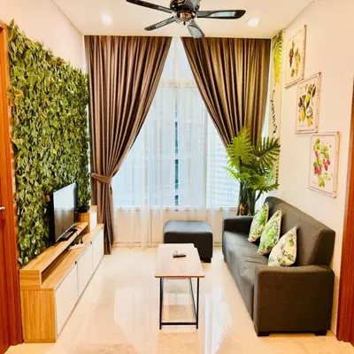 a living room with a couch and a tv at sky suites klcc by Sweet home Apartment in Kuala Lumpur