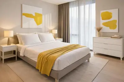 a bedroom with a bed with a yellow blanket on it at Trion Kuala Lumpur in Kuala Lumpur