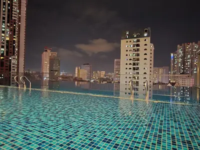 a swimming pool on top of a city skyline at KLCC SERVICED Suites CHAMBERS in Kuala Lumpur