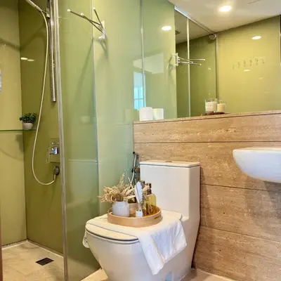a bathroom with a toilet and a shower and a sink at 30 OFF Monthly l Premium 3BR Suite in KLCC in Kuala Lumpur