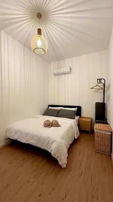 a bedroom with a bed and a chandelier at KayooKiddieHouse KLCC Kids Friendly at Kg Baru KL in Kuala Lumpur
