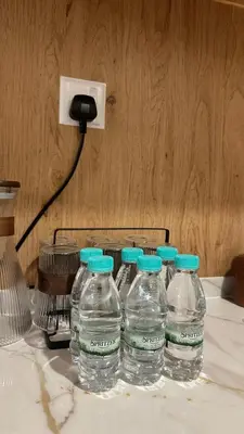 a group of water bottles sitting on a table at KayooKiddieHouse KLCC Kids Friendly at Kg Baru KL in Kuala Lumpur
