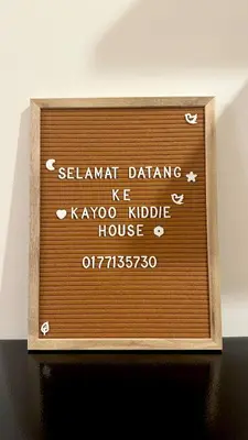 a wooden sign for a kokolde house at KayooKiddieHouse KLCC Kids Friendly at Kg Baru KL in Kuala Lumpur