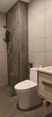 a bathroom with a shower and a toilet and a sink at Majestic Residence Klcc By DIVINA in Kuala Lumpur
