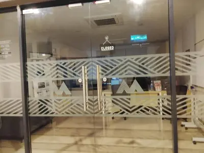 a sliding glass door in a store with a lobby at Majestic Residence Klcc By DIVINA in Kuala Lumpur