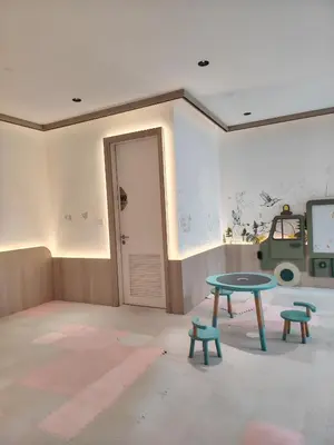 a room with a table and two benches at Scarletz Suites KLCC by cozy stay in Kuala Lumpur