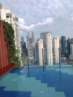 a swimming pool on top of a city skyline at Kuala Lumpur Majestic Suites KLCC in Kuala Lumpur