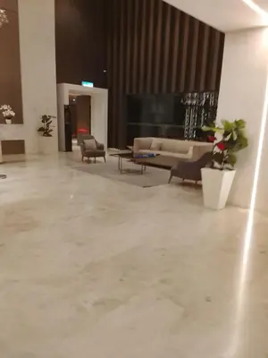 a living room with a couch and a table at Quill Kuala Lumpur Suites KLCC in Kuala Lumpur