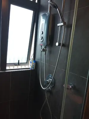a shower in a bathroom with a window at The Luxe Suites Colony Sky Pools in Kuala Lumpur