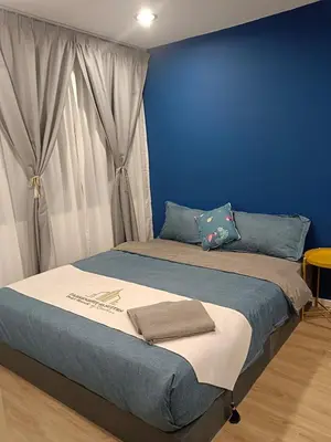 a blue bedroom with a bed with blue walls at Fahrenheit 88 4R in Kuala Lumpur