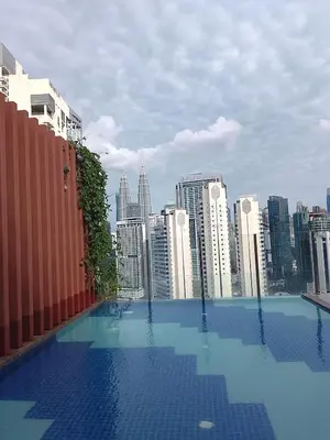 a swimming pool on top of a city skyline at Majestic Suites Quill Mall Apartment in Kuala Lumpur