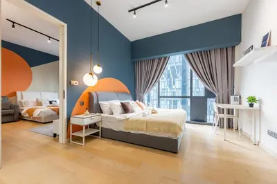 a bedroom with a bed and a large window at Star Residences One by The Conts in Kuala Lumpur