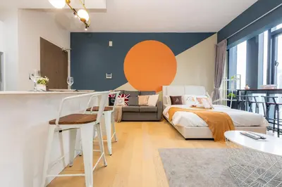 a bedroom with a bed and a couch at Star Residences One by The Conts in Kuala Lumpur