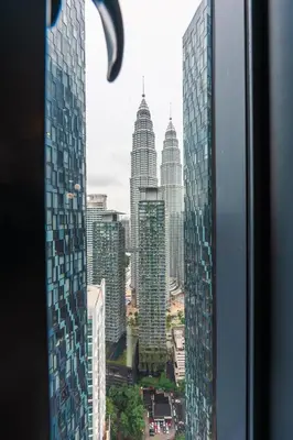 a view of a city with tall buildings from a window at Star Residences One by The Conts in Kuala Lumpur