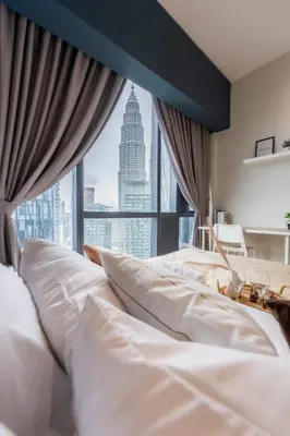 a bedroom with a large window with a city view at Star Residences One by The Conts in Kuala Lumpur