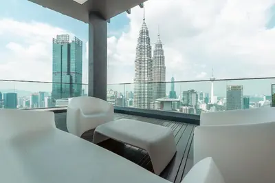a balcony with a view of the city at Star Residences One by The Conts in Kuala Lumpur