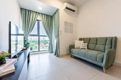 a living room with a couch and a large window at The Atrium by The Conts in Kuala Lumpur