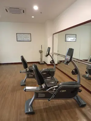 a gym with three exercise bikes in a room at Times square Suites at Time Square KL in Kuala Lumpur