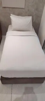 a large white bed in a room with at Sky Suites at Quill Residence Kuala Lumpur in Kuala Lumpur