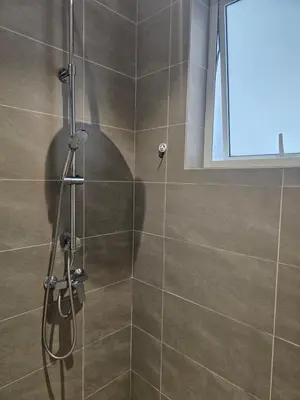 a bathroom with a shower with a glass door at Spacious Stylish Suite at Quill Resi KLCC 2Bed7Pax in Kuala Lumpur