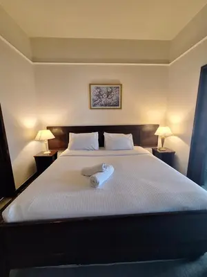 a bedroom with a bed with a towel on it at Suite at Bukit Bintang in Kuala Lumpur