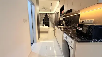 a kitchen with a sink and a dishwasher at Majestic Sky Deck Suites in Kuala Lumpur